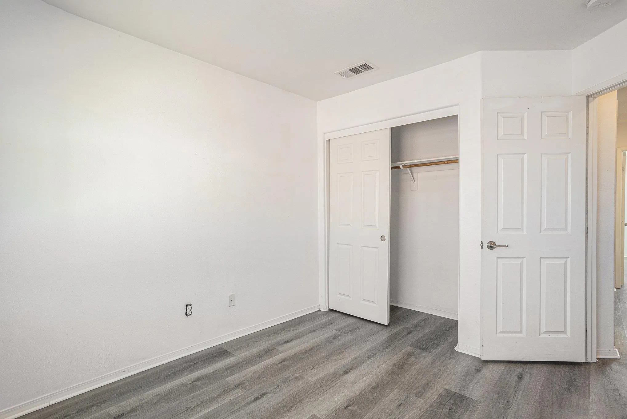 2840 Athens Road, Unit 10 Chula Vista, CA 91915 - Photo 31 of 56 a view of an empty room with wooden floor and closet area