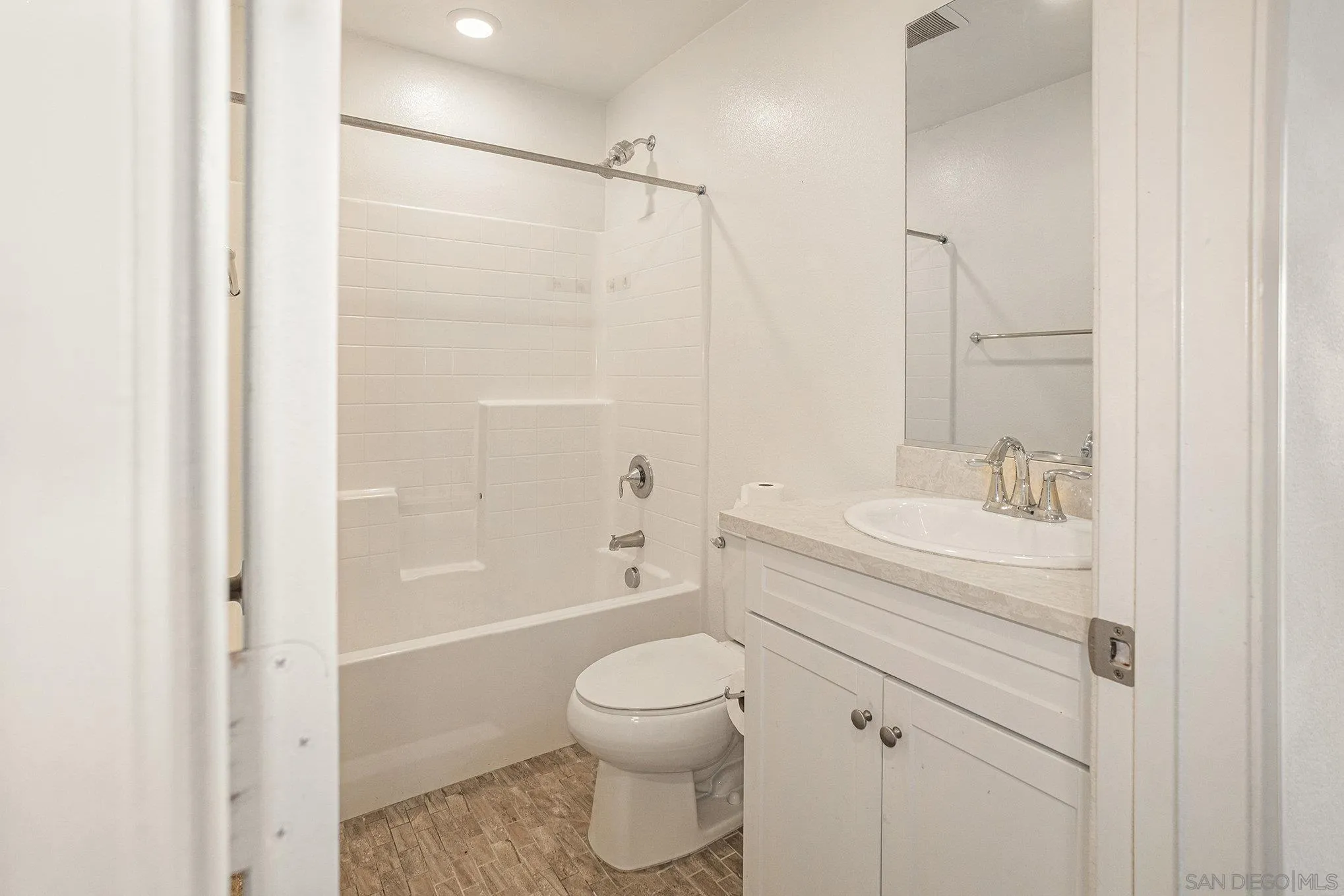 2840 Athens Road, Unit 10 Chula Vista, CA 91915 - Photo 33 of 56 a bathroom with a granite countertop sink a toilet and shower