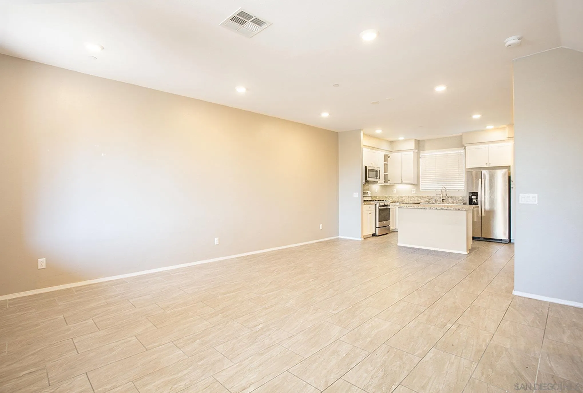 2840 Athens Road, Unit 10 Chula Vista, CA 91915 - Photo 7 of 56 a view of a kitchen with a sink and a refrigerator