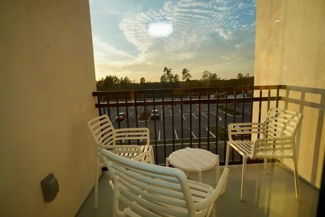 a bedroom with a large bed and a large window