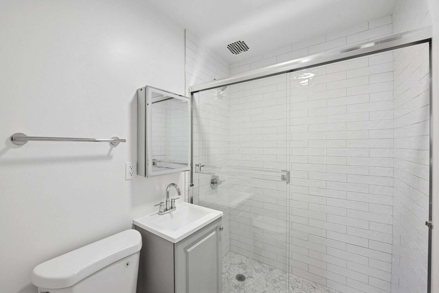 145 West 80th Street, Unit 4R Manhattan, NY 10024 - Photo 13 of 16 a bathroom with a sink a toilet and shower