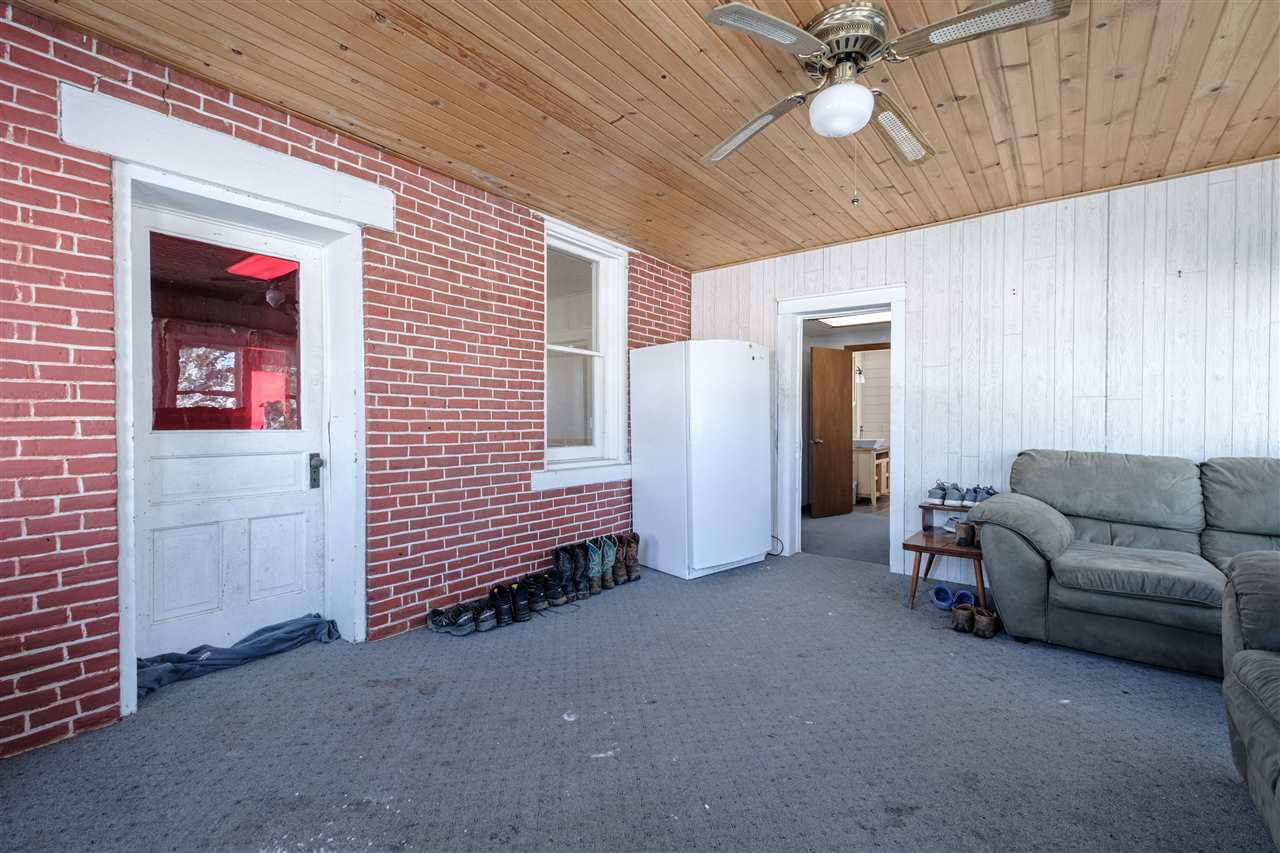 10217 North Adeline Road German Valley, IL 61039 - Photo 7 of 40 a living room with furniture and a ceiling fan