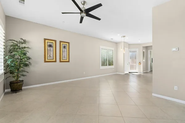 a view of livingroom with hardwood floor and a ceiling fan