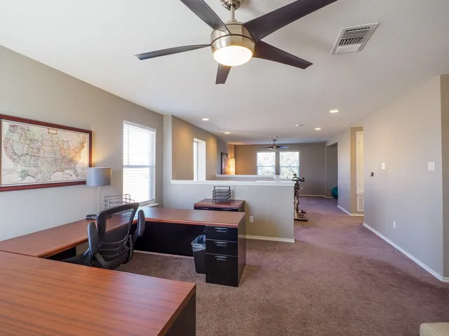 a bed room with furniture and window