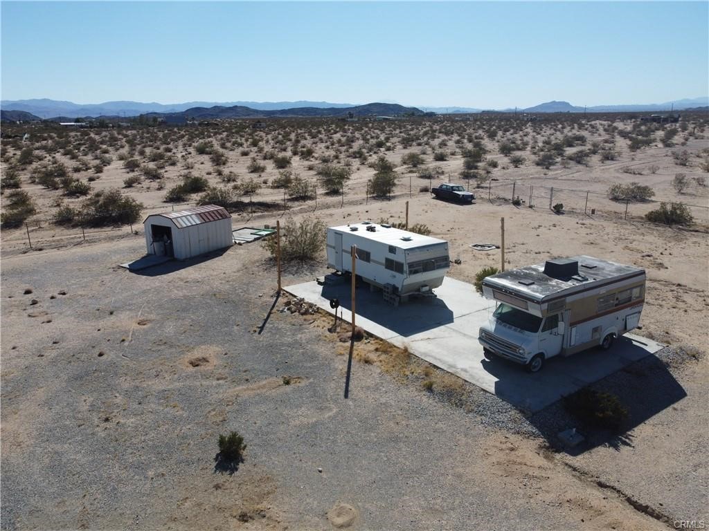 1188 Mile Square Road Joshua Tree, CA 92252 - Photo 14 of 18 a view of a terrace with chairs