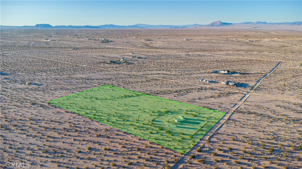 1188 Mile Square Road Joshua Tree, CA 92252 - Photo 17 of 18 a view of a lake with a mountain