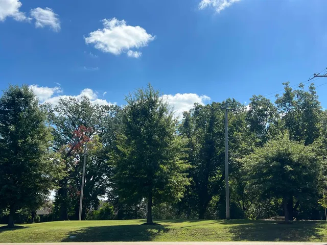 a view of a swimming pool with an outdoor space and seating area