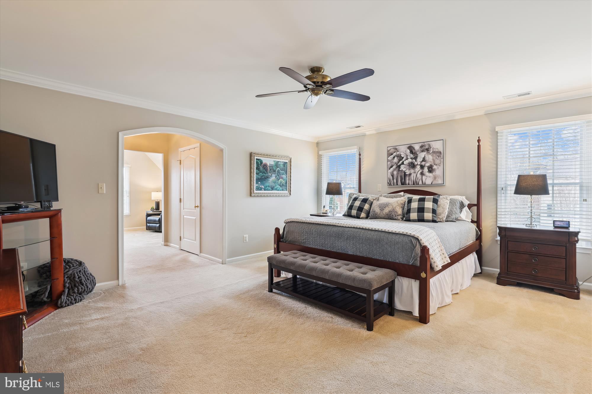 10904 Hunter Gate Way Reston, VA 20194 - Photo 29 of 90 a bedroom with a bed and a flat screen tv