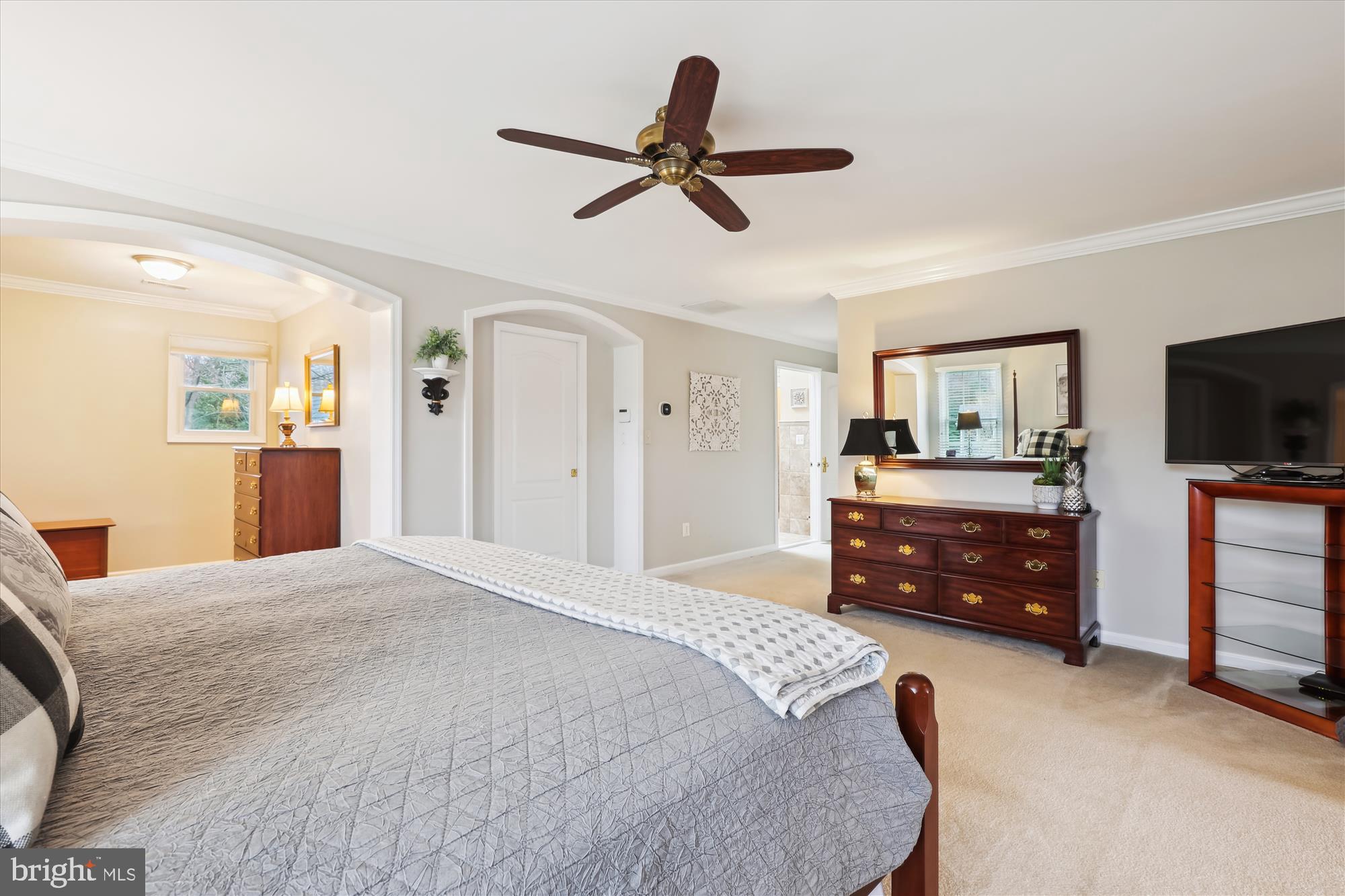 10904 Hunter Gate Way Reston, VA 20194 - Photo 31 of 90 a bedroom with a bed and a flat screen tv