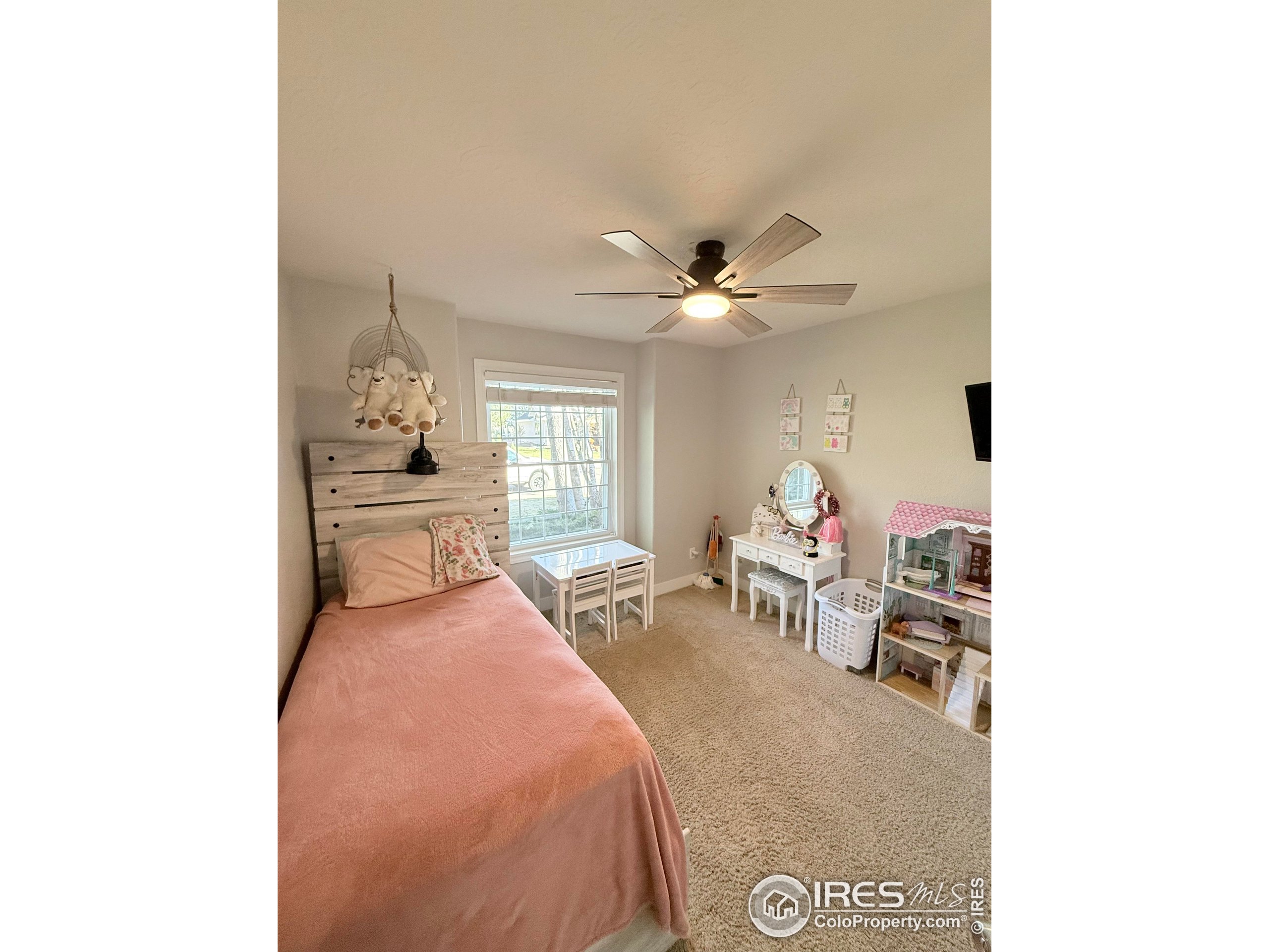 1460 Hawkridge Road Eaton, CO 80615 - Photo 11 of 20 a living room with furniture and a chandelier