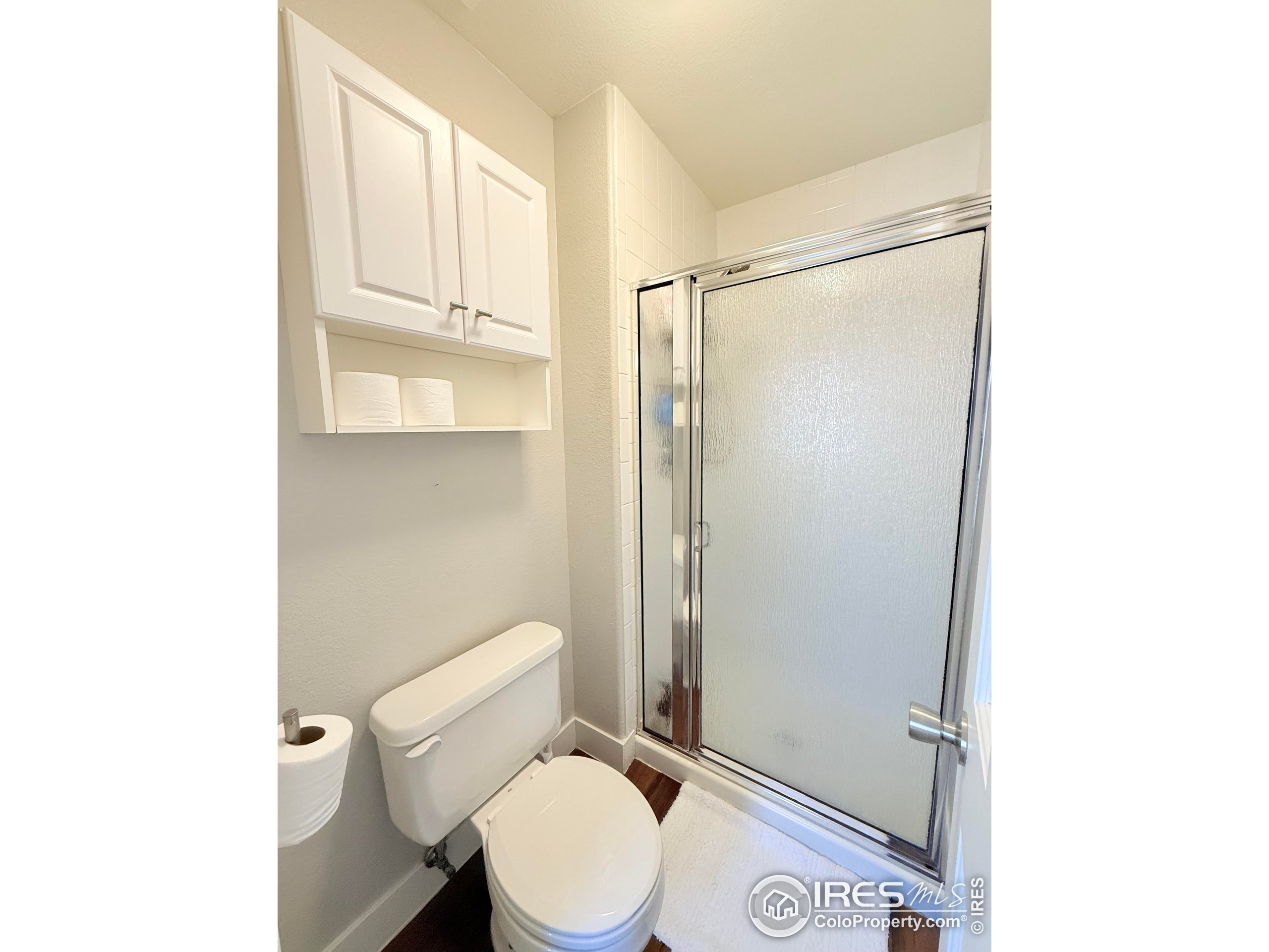1460 Hawkridge Road Eaton, CO 80615 - Photo 14 of 20 a white toilet sitting next to a bathroom sink