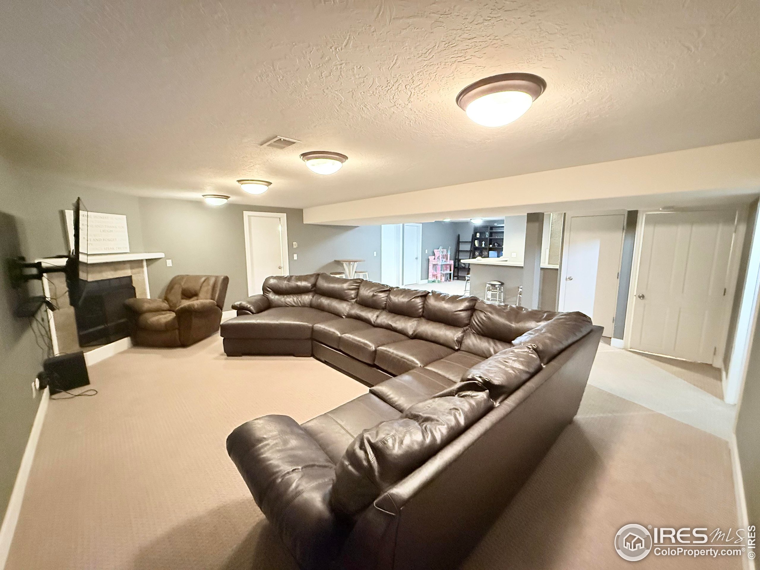 1460 Hawkridge Road Eaton, CO 80615 - Photo 15 of 20 a living room with furniture and a wooden floor
