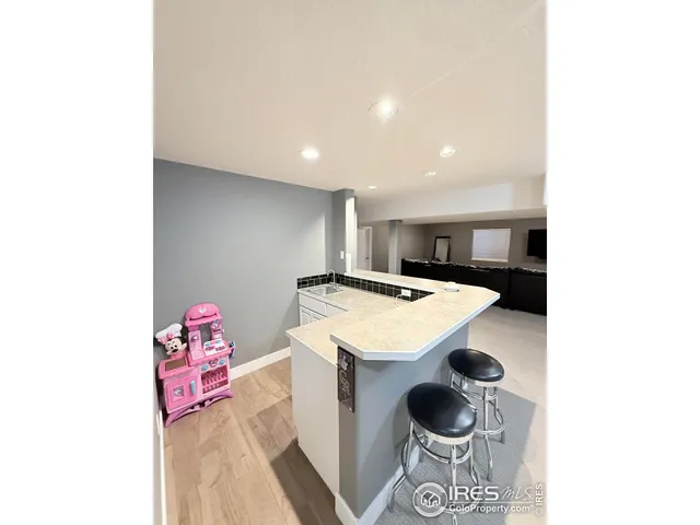 a bedroom with a bed and dresser