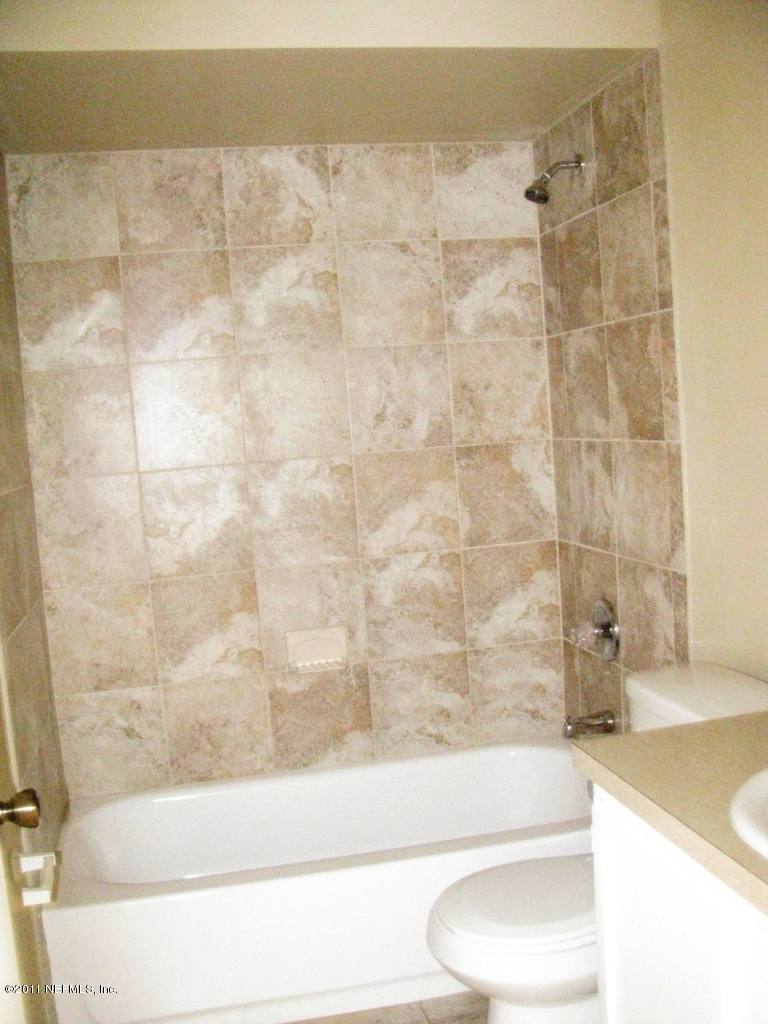 8346 Chason Road East Jacksonville, FL 32244 - Photo 13 of 18 Guest Bath fully tiled bath enclosure