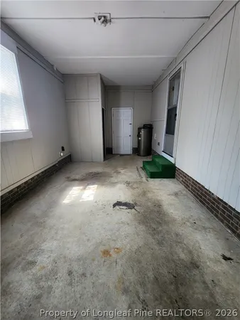 a view of a livingroom with an empty space and a window