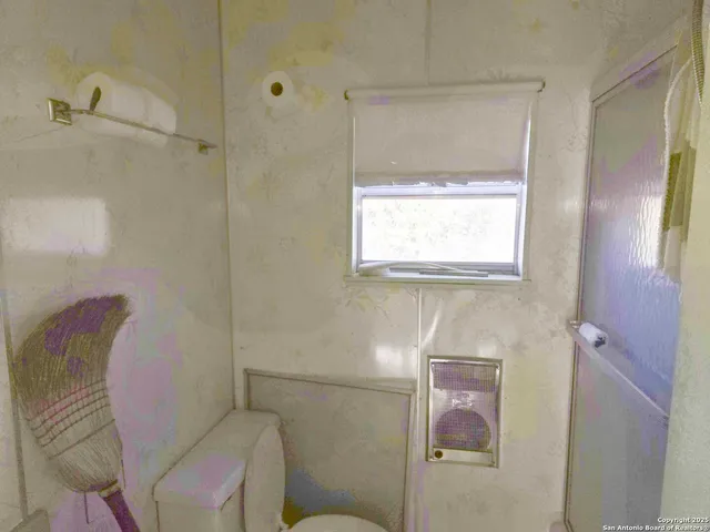 a bathroom with a toilet and a sink