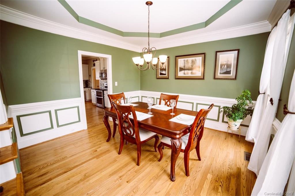 522 Zackery Lane Fort Mill, SC 29708 - Photo 4 of 24 a view of a dining room with furniture and wooden floor