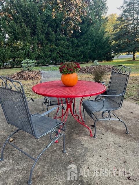 79 Davidson's Mill Road North Brunswick, NJ 08902 - Photo 7 of 30 a view of a swimming pool with a dining table and chairs