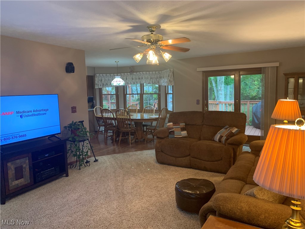 9046 Shepard Road Macedonia, OH 44056 - Photo 5 of 33 Living room with lighted ceiling fan and carpeted flooring