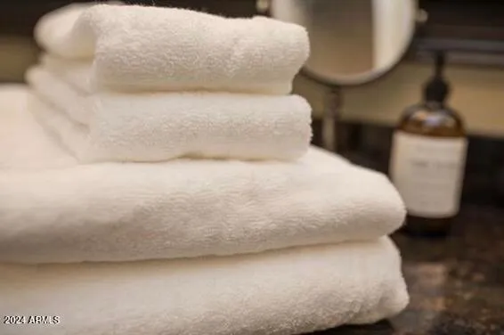 a large white bed sitting in a bedroom