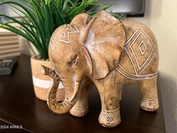 a water vase with trees and wooden floor