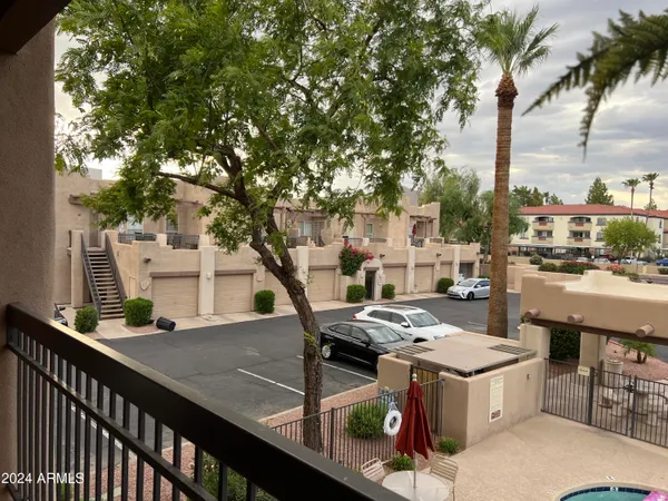 a view of a balcony with furniture