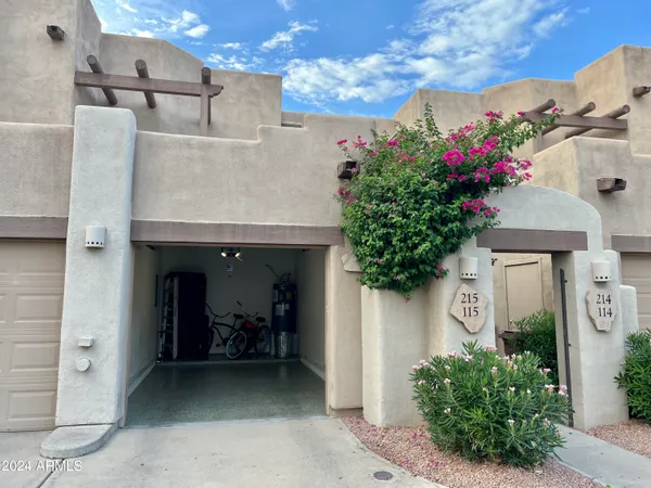 a view of a house with a flower garden