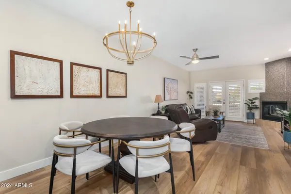 a view of a dining room with furniture window and wooden floor