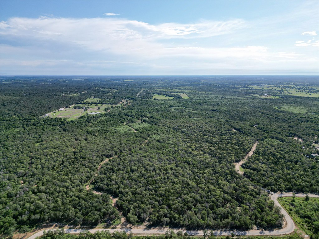 995 Carter Road Dale, TX 78616 - Photo 13 of 28 an aerial view of residential house with green space
