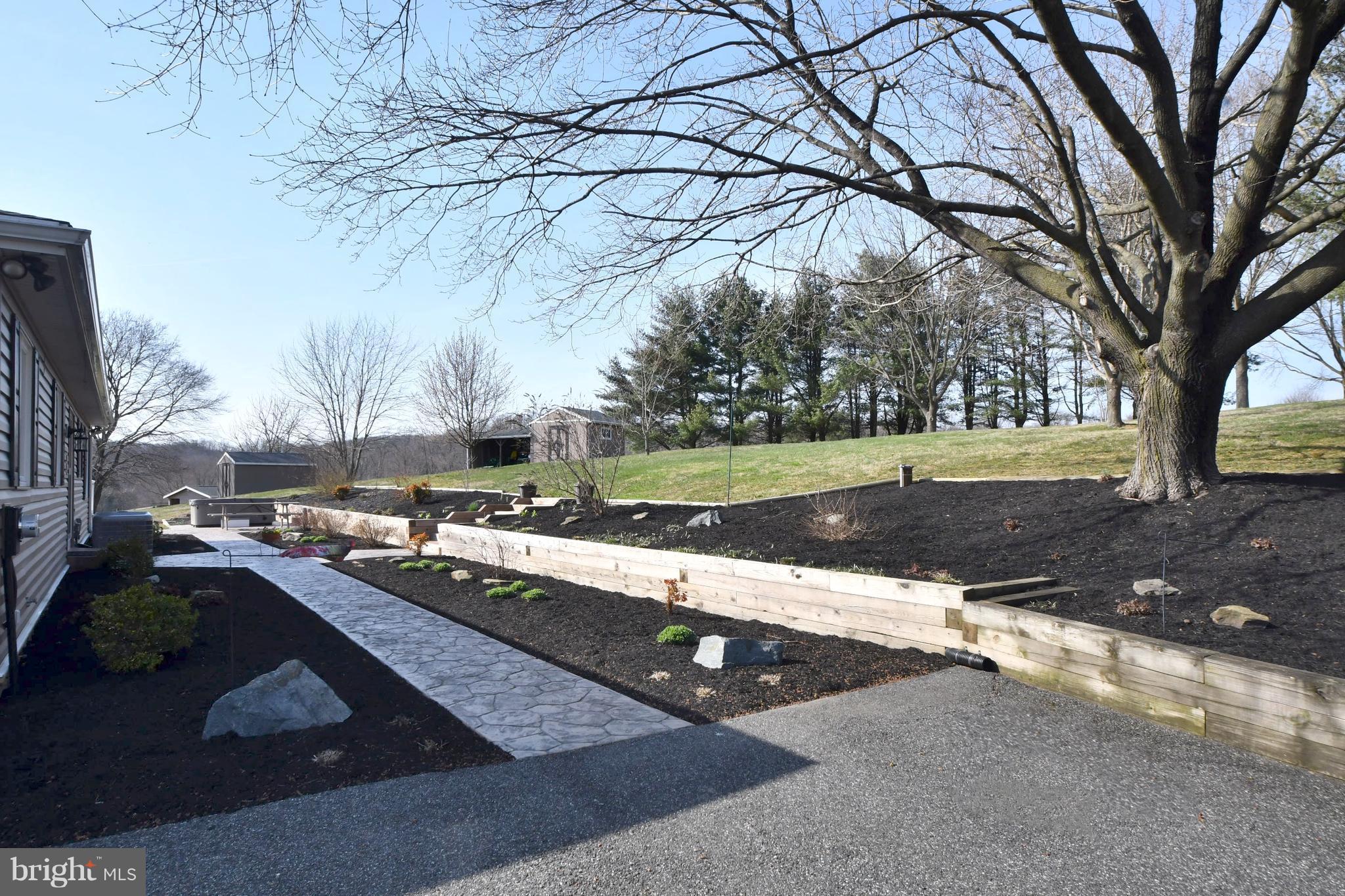 718 Cherry Hill Road Street, MD 21154 - Photo 18 of 30 Beautifully Landscaped stamped concrete walkway