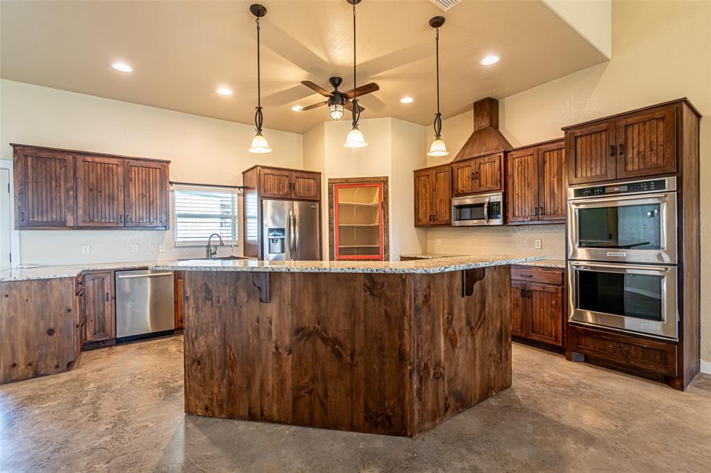 9110 Asbury Road Tolar, TX 76476 - Photo 17 of 40 Island with breakfast bar