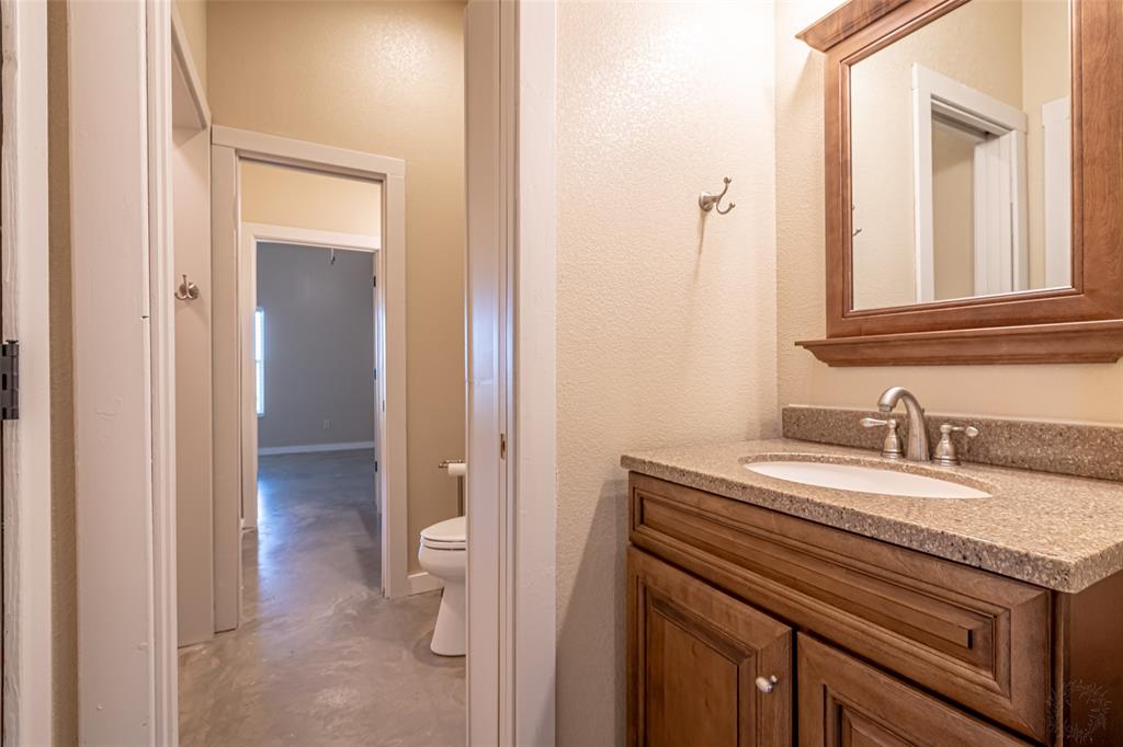 9110 Asbury Road Tolar, TX 76476 - Photo 23 of 40 Jack and Jill bath between secondary bedrooms.