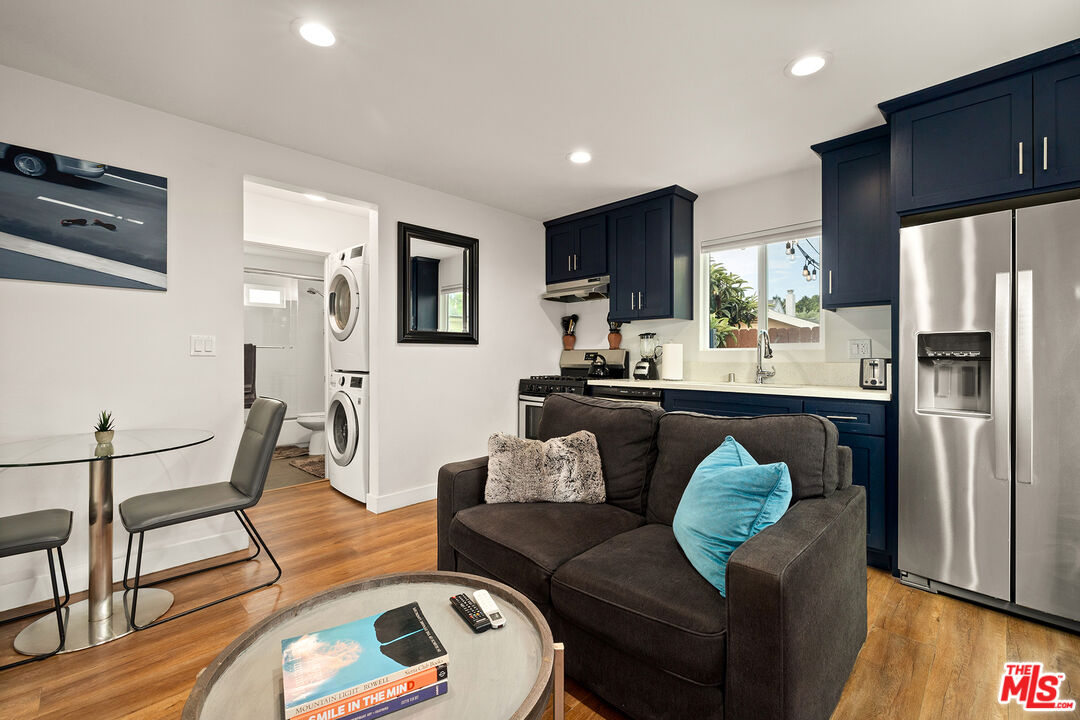 5325 9th Avenue, Unit 5327 Los Angeles, CA 90043 - Photo 3 of 11 a living room with stainless steel appliances furniture or couch and a flat screen tv