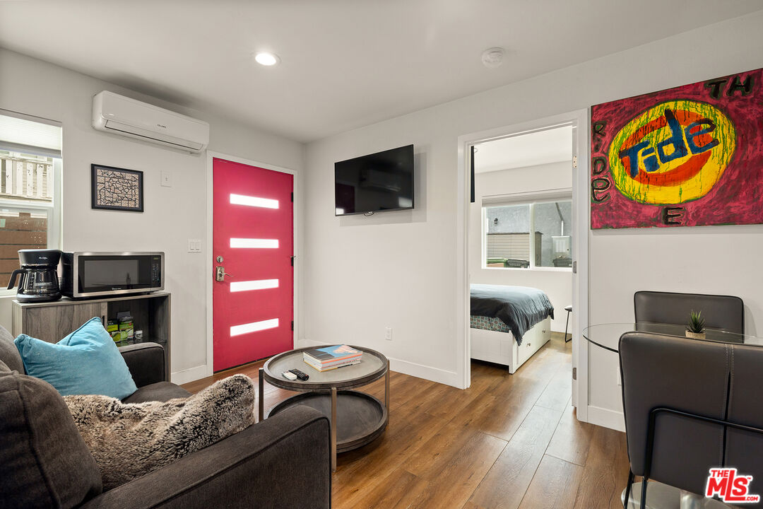 5325 9th Avenue, Unit 5327 Los Angeles, CA 90043 - Photo 4 of 11 a living room with furniture and a flat screen tv