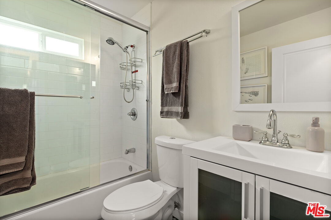 5325 9th Avenue, Unit 5327 Los Angeles, CA 90043 - Photo 8 of 11 a bathroom with a sink toilet and shower
