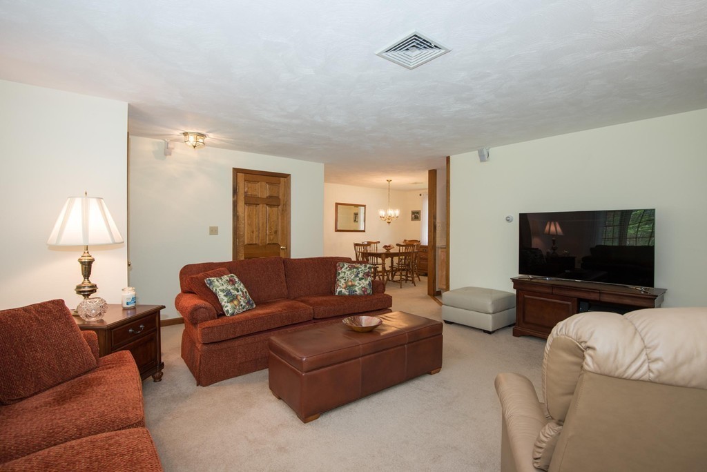 2 Howe Street Ipswich, MA 01938 - Photo 8 of 27 a living room with furniture and a flat screen tv