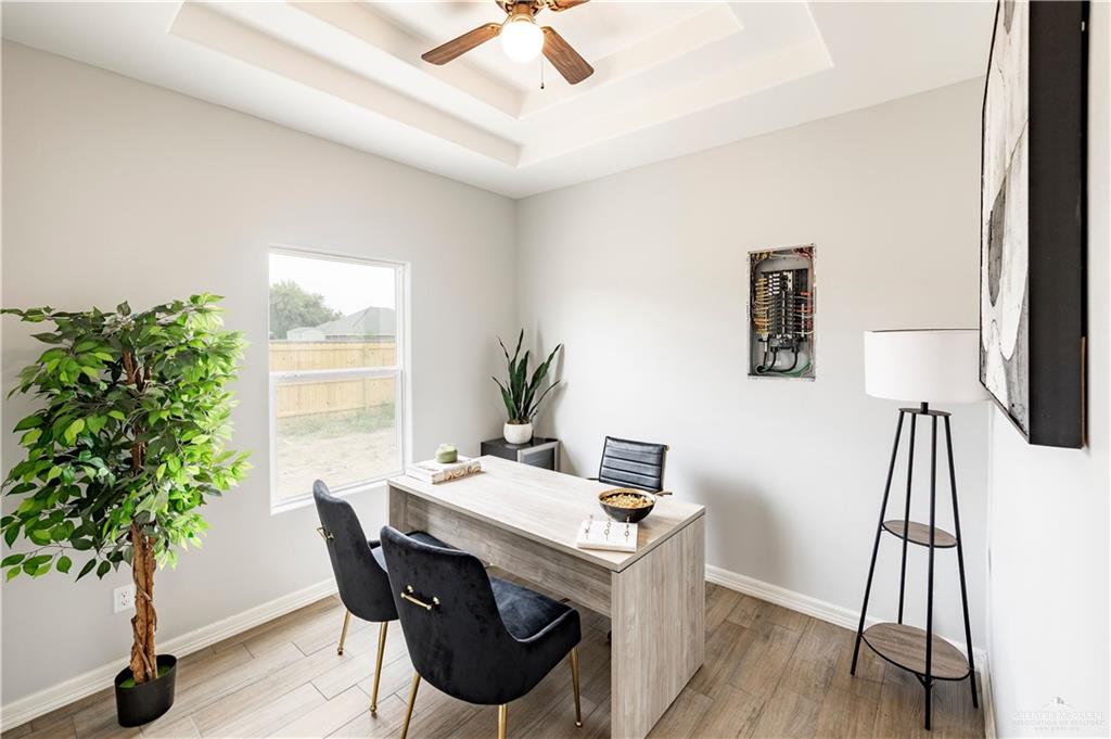 508 Bridget Street Weslaco, TX 78596 - Photo 15 of 19 a view of a workspace with furniture and a potted plant