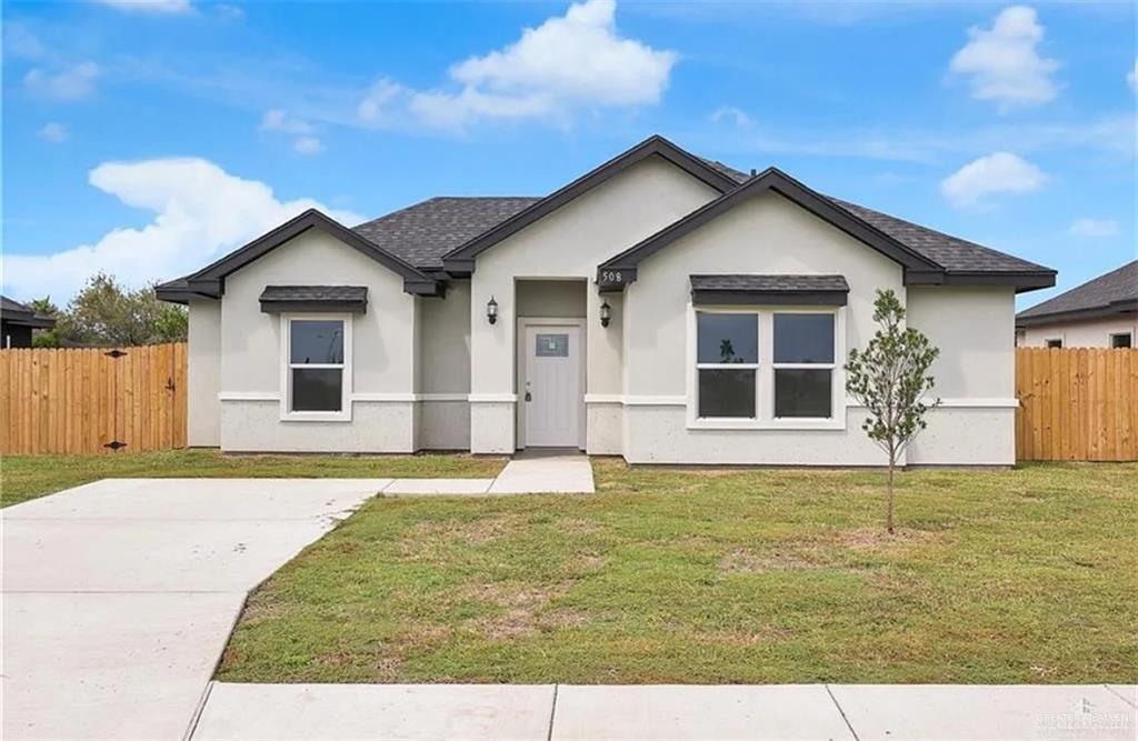 508 Bridget Street Weslaco, TX 78596 - Photo 2 of 19 a front view of a house with a yard