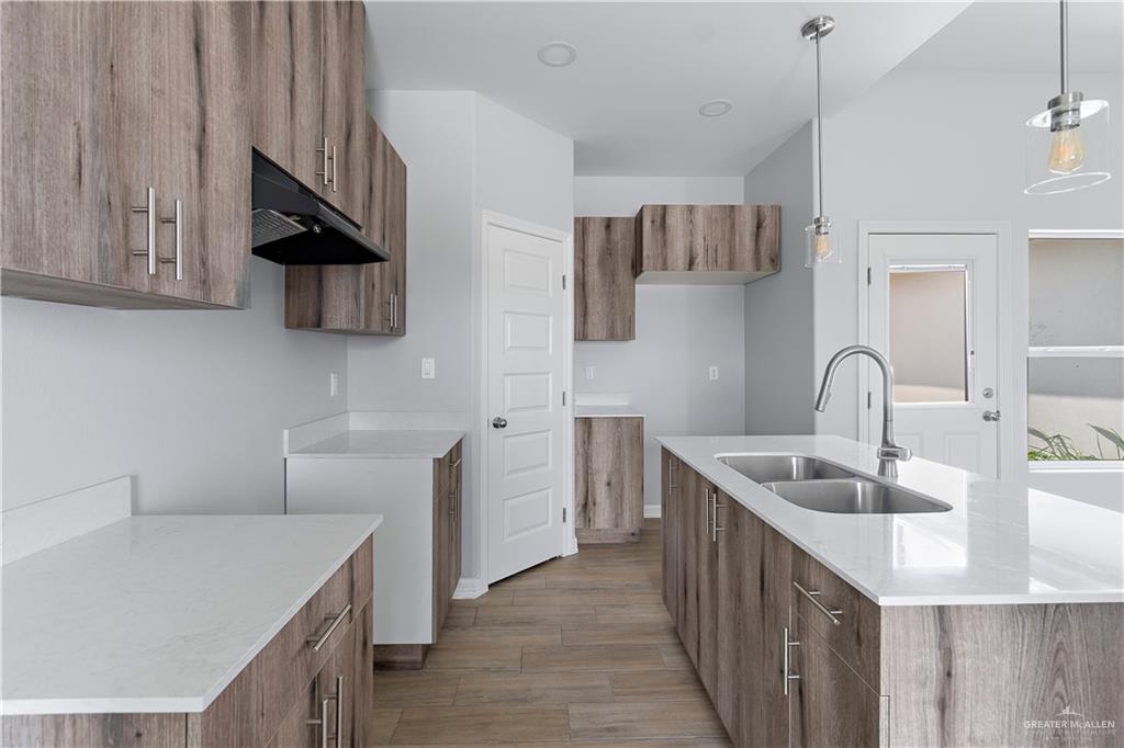 508 Bridget Street Weslaco, TX 78596 - Photo 4 of 19 a kitchen with stainless steel appliances a sink a stove and a refrigerator