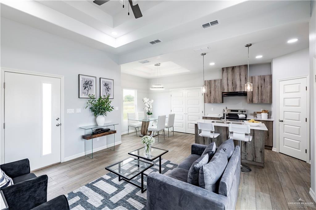 508 Bridget Street Weslaco, TX 78596 - Photo 5 of 19 a living room with lots of furniture and kitchen view