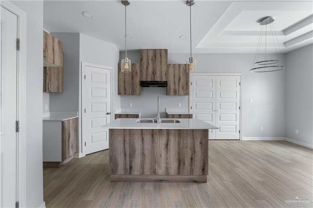 508 Bridget Street Weslaco, TX 78596 - Photo 7 of 19 a kitchen with stainless steel appliances granite countertop a sink stove and refrigerator