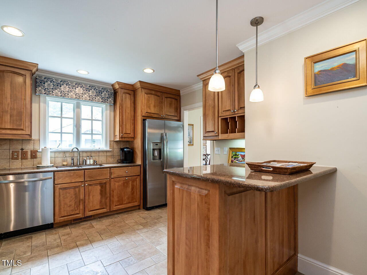 2312 Gaddy Drive Raleigh, NC 27609 - Photo 11 of 32 a kitchen with stainless steel appliances granite countertop a sink and a refrigerator