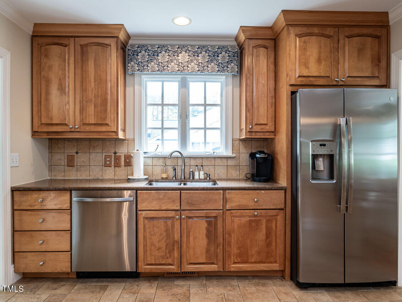 2312 Gaddy Drive Raleigh, NC 27609 - Photo 12 of 32 a kitchen with stainless steel appliances granite countertop a refrigerator and a stove