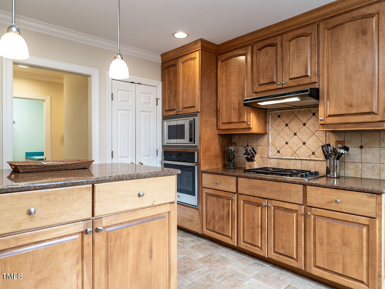2312 Gaddy Drive Raleigh, NC 27609 - Photo 13 of 32 a kitchen with granite countertop a sink and cabinets