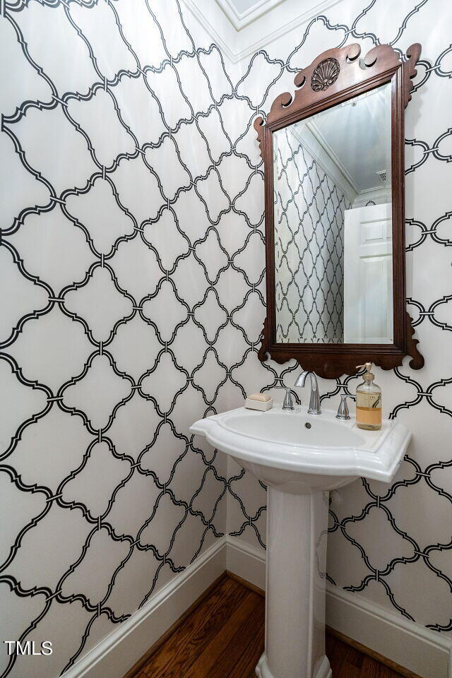 2312 Gaddy Drive Raleigh, NC 27609 - Photo 18 of 32 a bathroom with a sink and a mirror