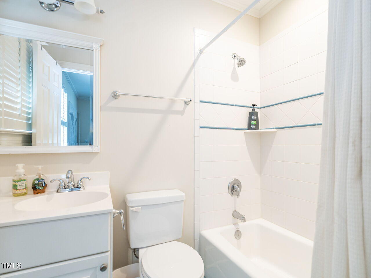 2312 Gaddy Drive Raleigh, NC 27609 - Photo 25 of 32 a bathroom with a bathtub shower sink vanity and toilet