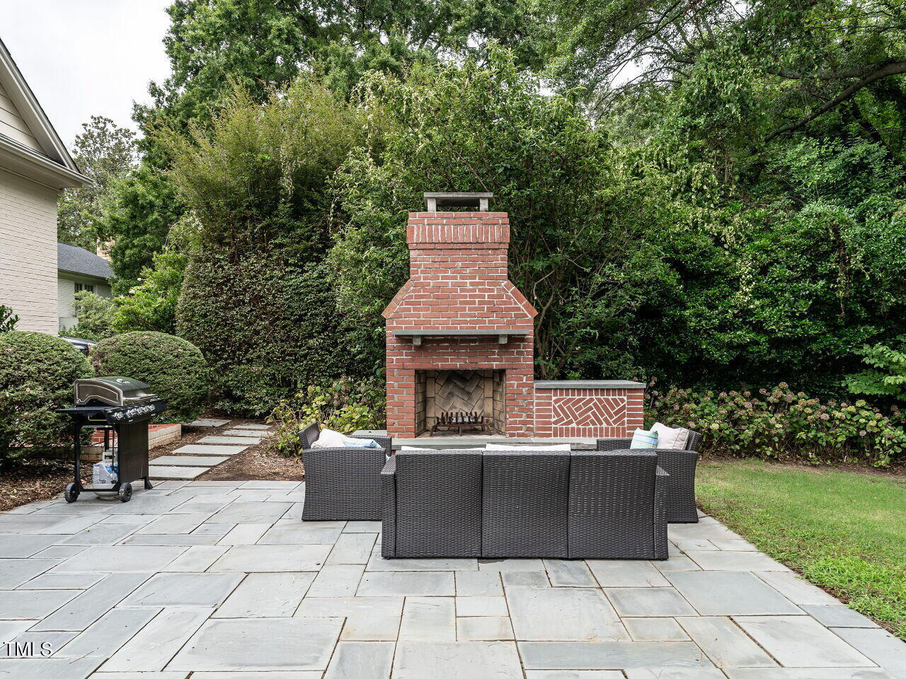 2312 Gaddy Drive Raleigh, NC 27609 - Photo 29 of 32 a view of a patio with a fireplace