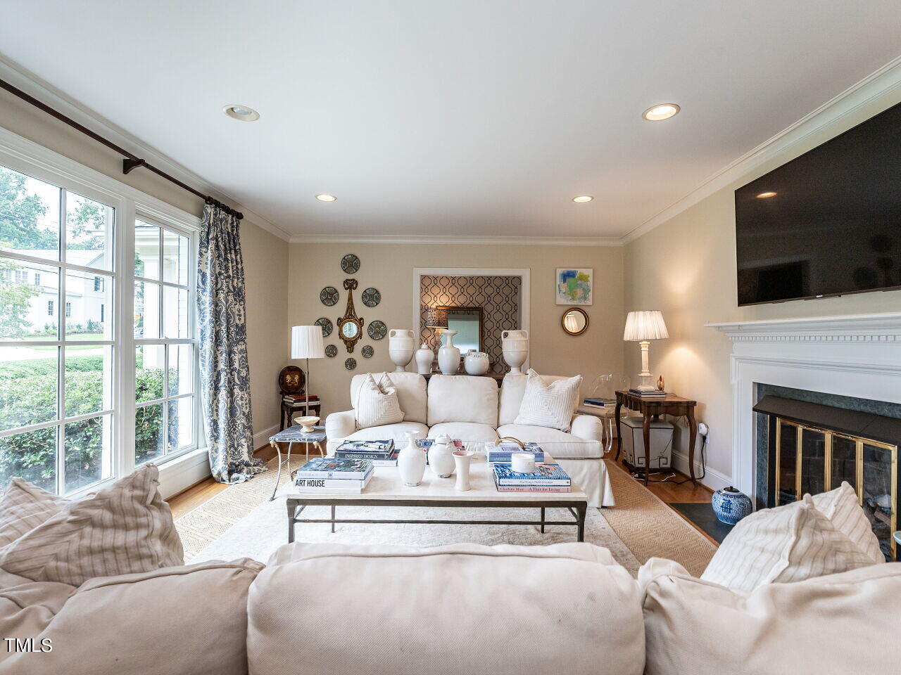 2312 Gaddy Drive Raleigh, NC 27609 - Photo 8 of 32 a living room with fireplace furniture and a flat screen tv