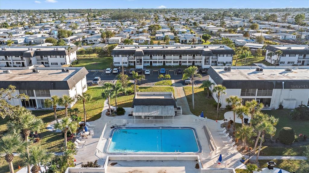 102 47th Ave Drive West, Unit 342 Bradenton, FL 34207 - Photo 15 of 20 an aerial view of a house with a swimming pool outdoor seating yard and swimming pool