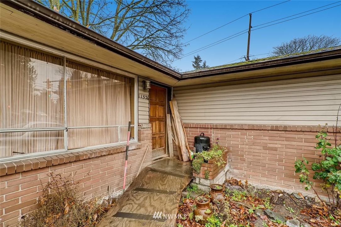 11526 Southeast Petrovitsky Road Renton, WA 98055 - Photo 2 of 28 a view of house with outdoor seating